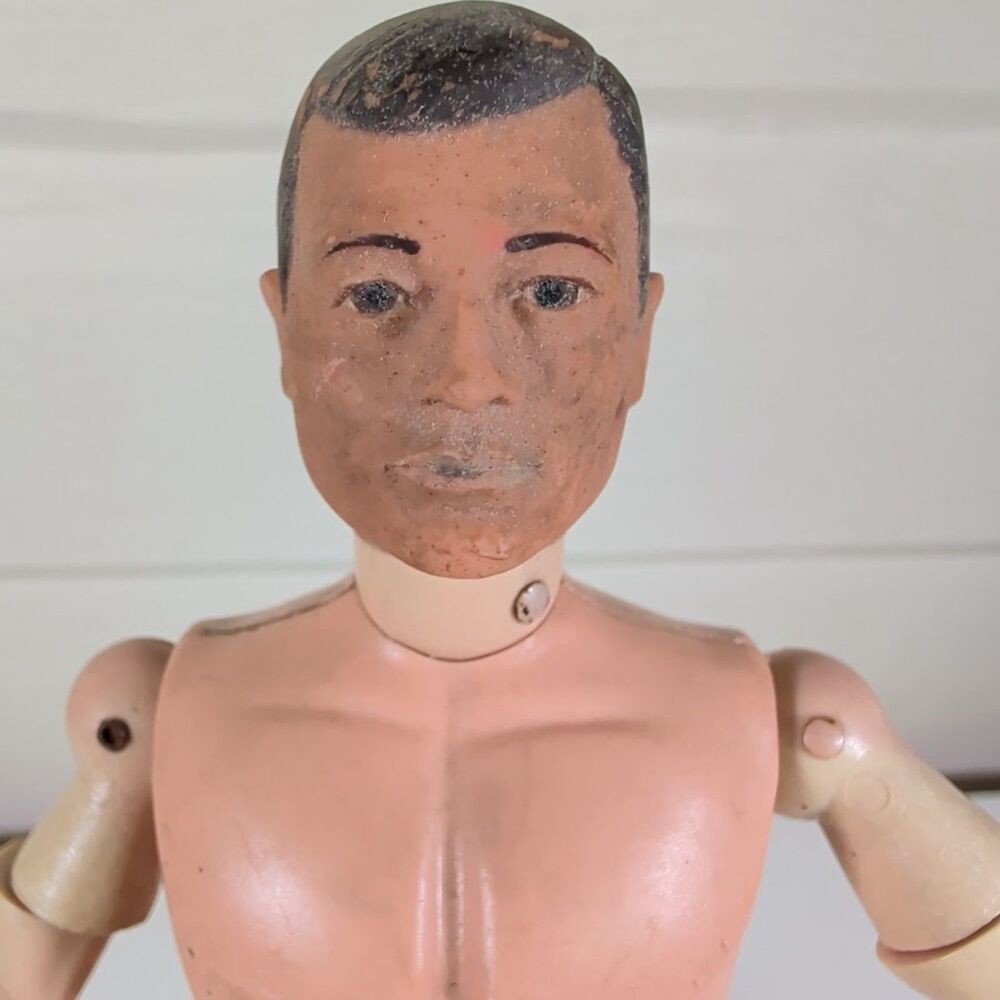 Vintage 1964 Hasbro G.I. Joe action figure with a soft head